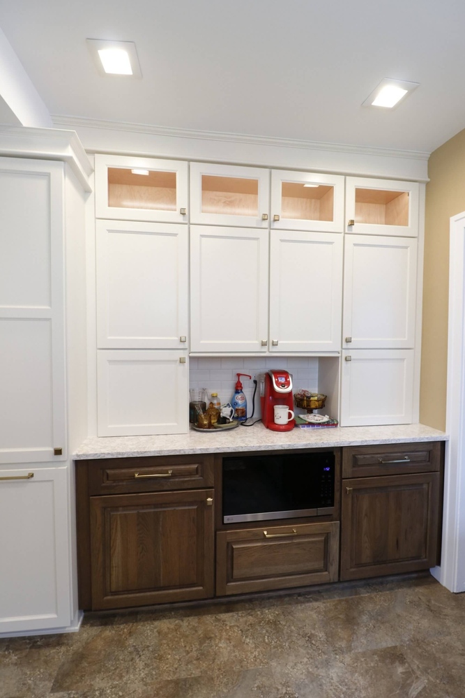 Lansing Westside MI kitchen remodel by Odd Fellows Contracting showcasing custom white cabinetry and built-ins