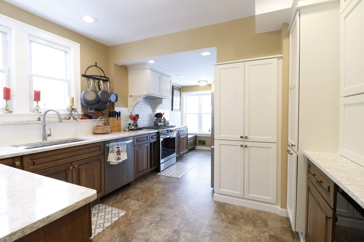 Wide view of remodeled kitchen by Odd Fellows Contracting in Lansing Westside MI with custom cabinetry and updated flooring