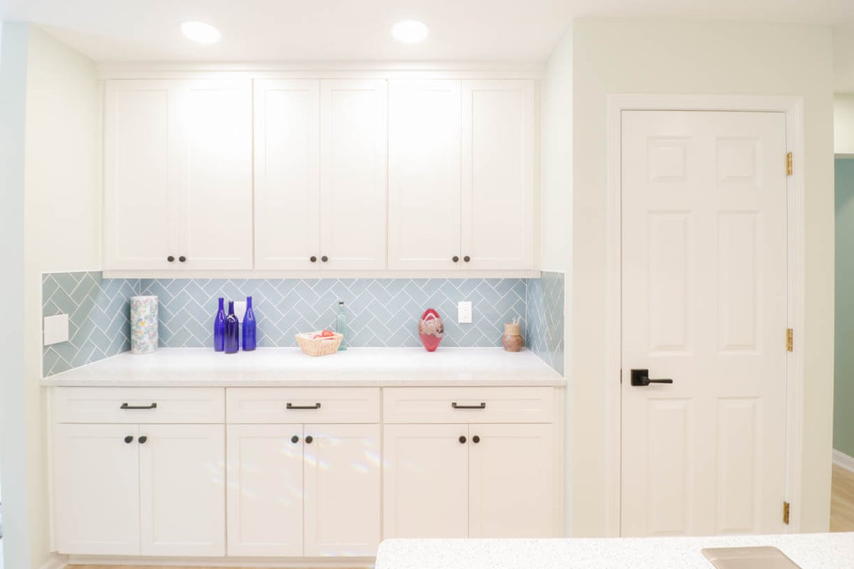 bright kitchen remodel in Emerald Lake, MI by Odd Fellows Contracting with custom cabinets and backsplash