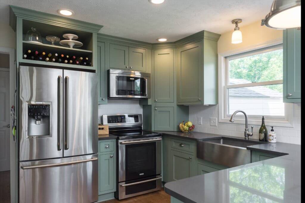 Kitchen remodel with stainless appliances and custom green cabinets in Williamston MI by Odd Fellows Contracting