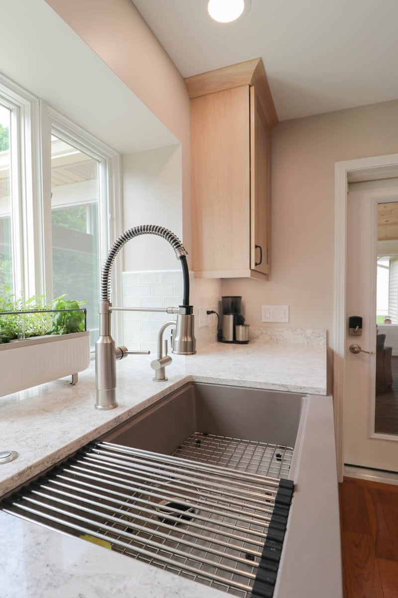 Kitchen sink and cabinetry detail in Cornell Woods, MI custom home built by Odd Fellows Contracting.