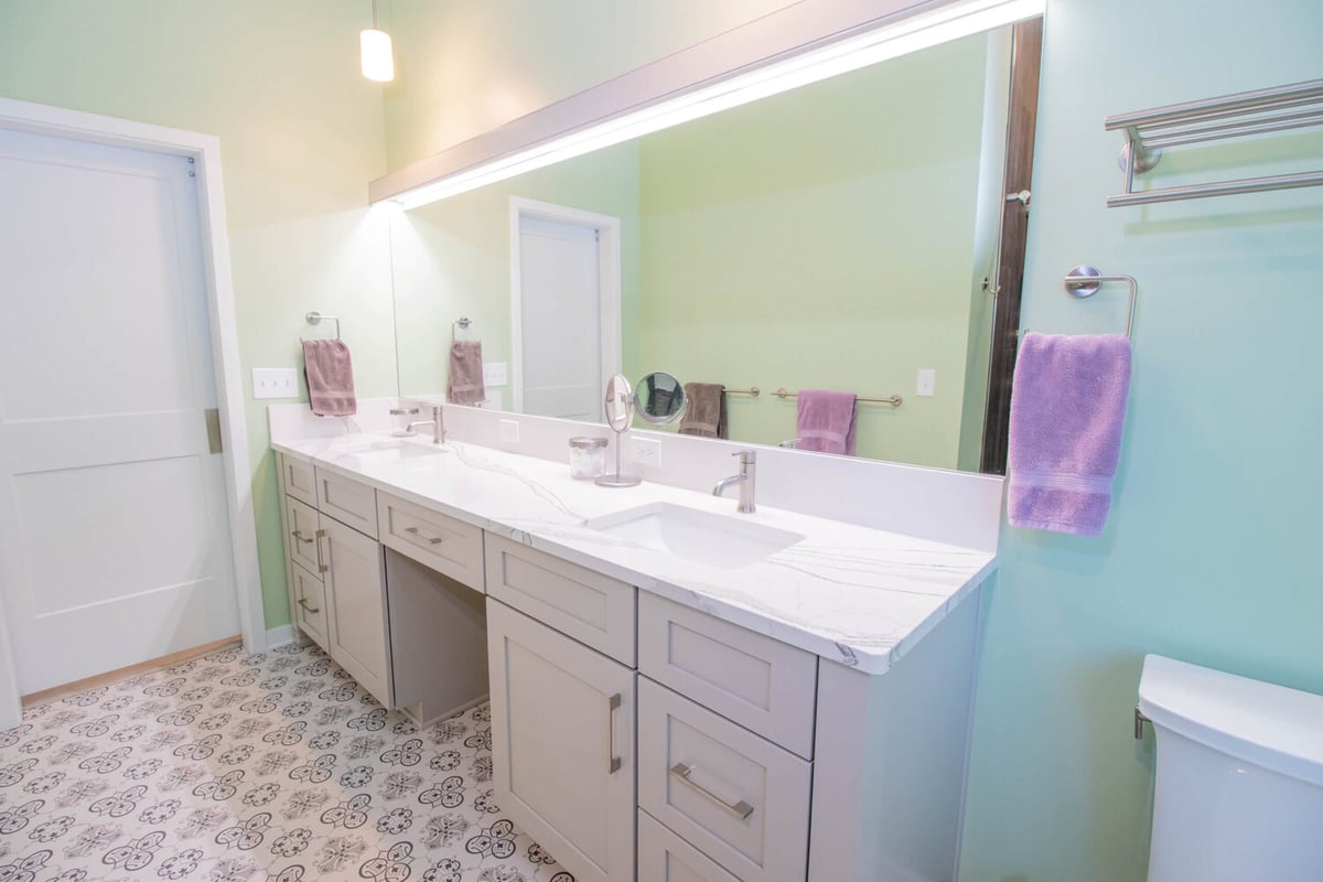 bathroom vanity by Odd Fellows Contracting in Williamston MI with double sink and quartz countertop