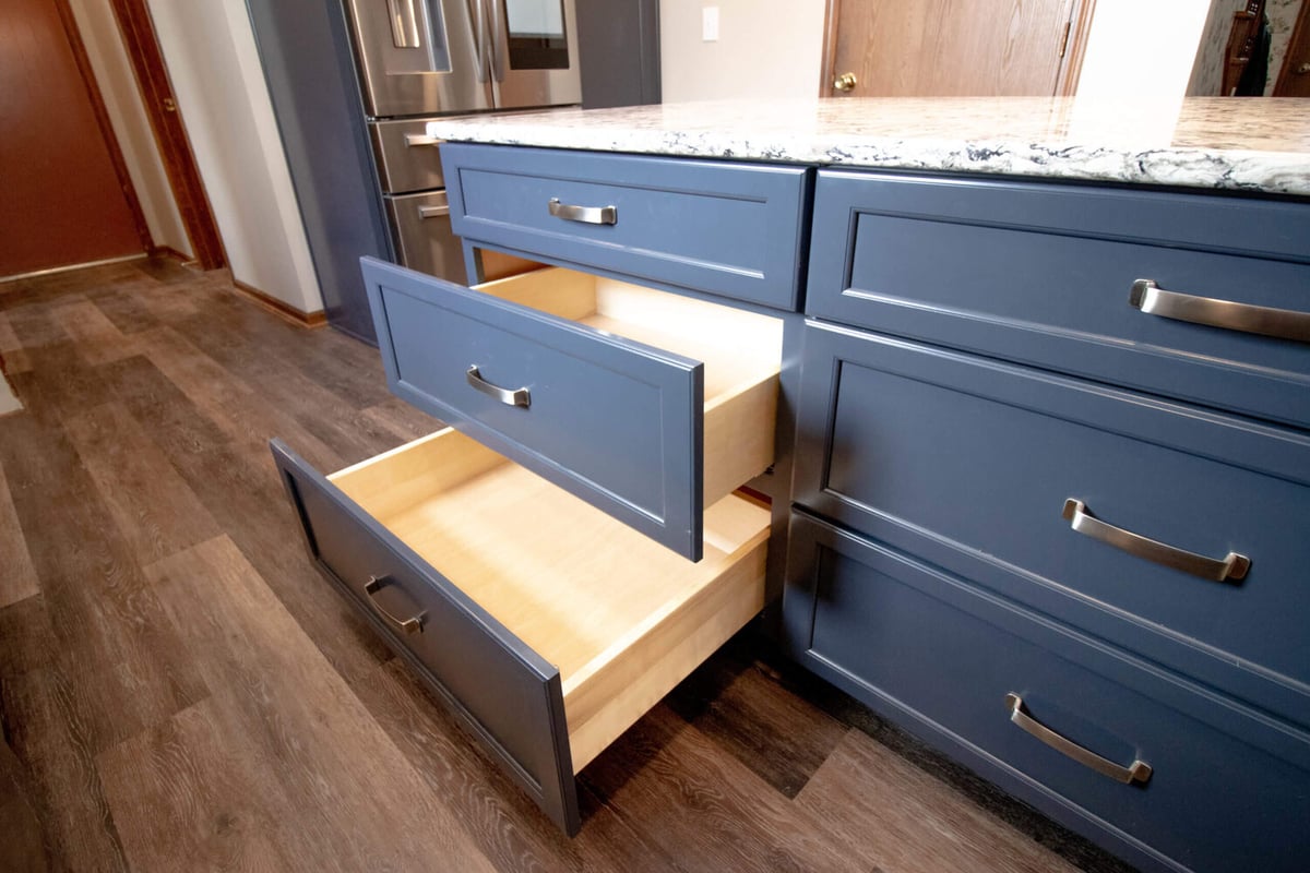 kitchen storage solution by Odd Fellows Contracting in Mason MI featuring deep drawers and blue cabinets