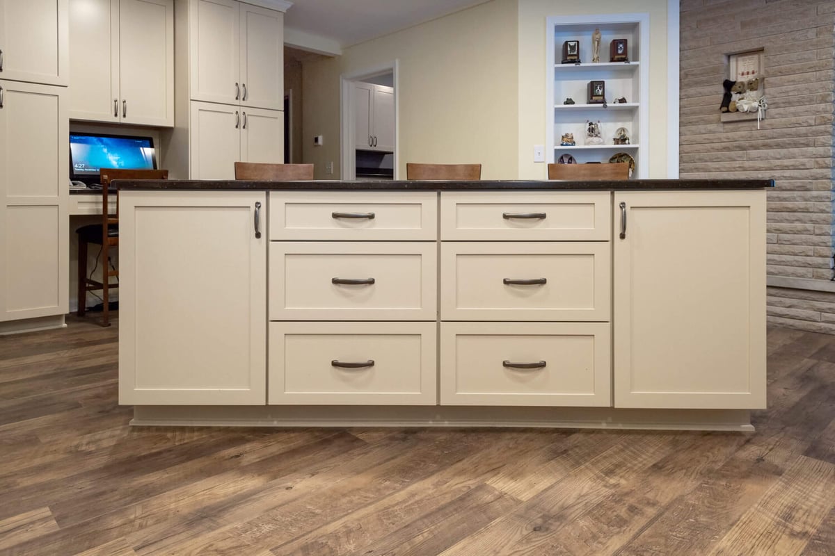 kitchen island cabinetry with quartz countertop and storage drawers in remodeled Lansing kitchen by Odd Fellows Contracting