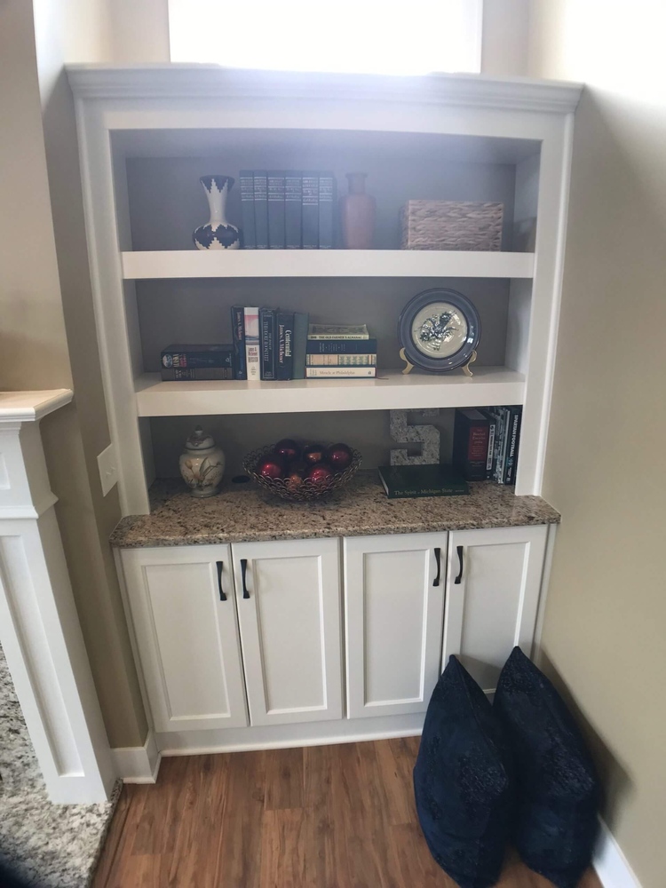 built in shelving cabinet detail in family room remodel by Odd Fellows Contracting in Holt, MI