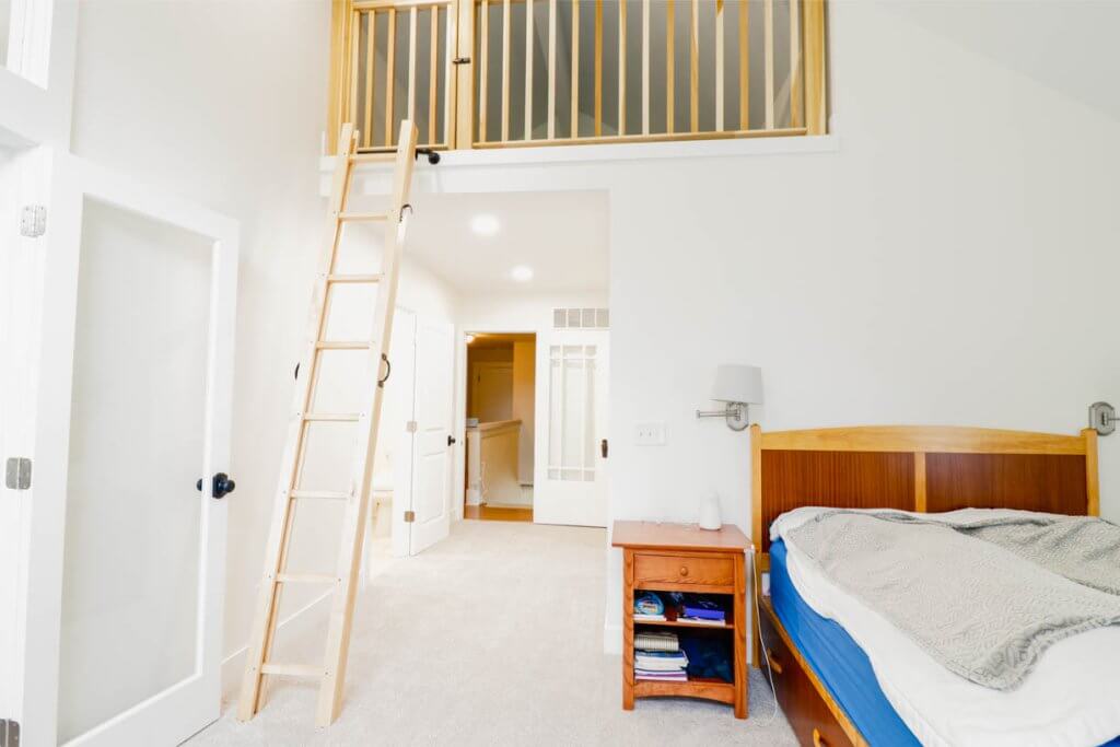 custom home bedroom addition by Odd Fellows Contracting in Lansing, MI featuring elevated loft space