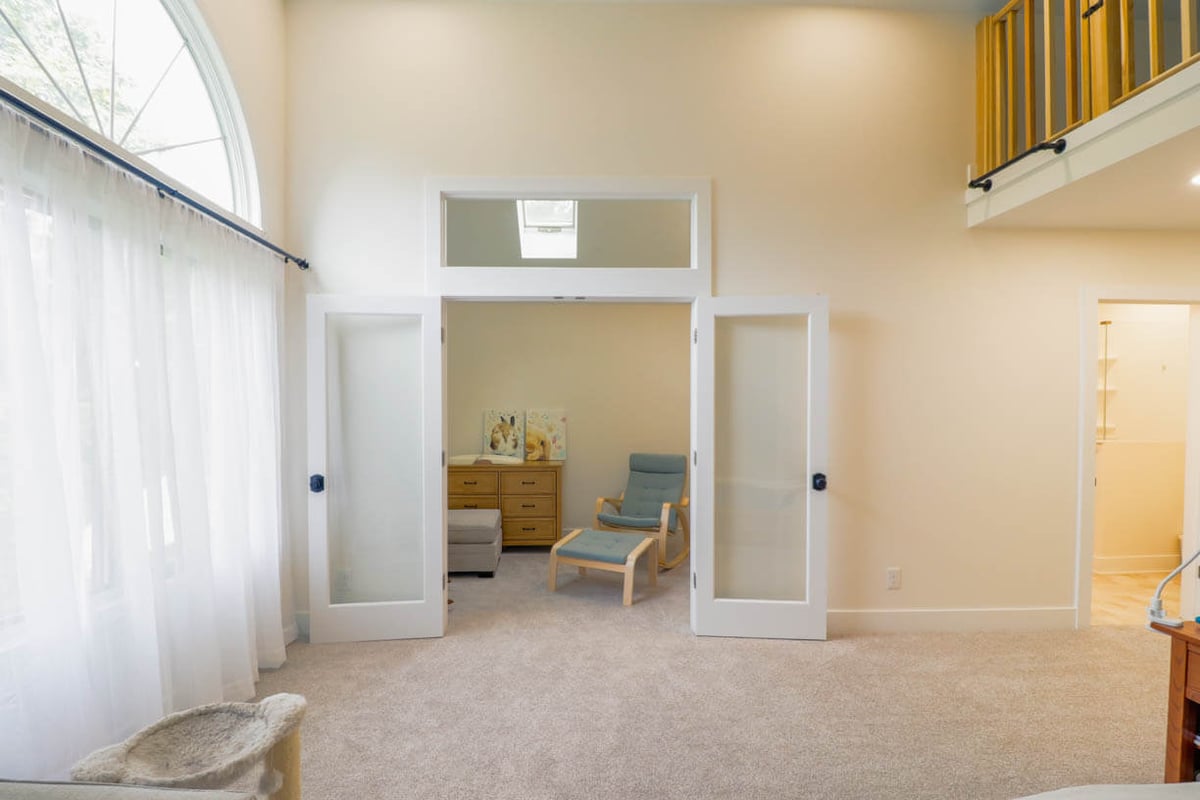custom home interior renovation by Odd Fellows Contracting in Lansing, MI showcasing new French doors