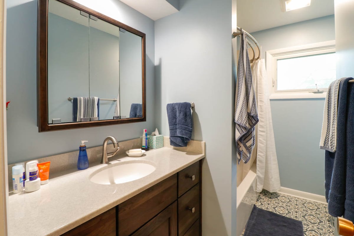 Cornell Okemos, MI custom home bathroom by Odd Fellows Contracting featuring single sink vanity