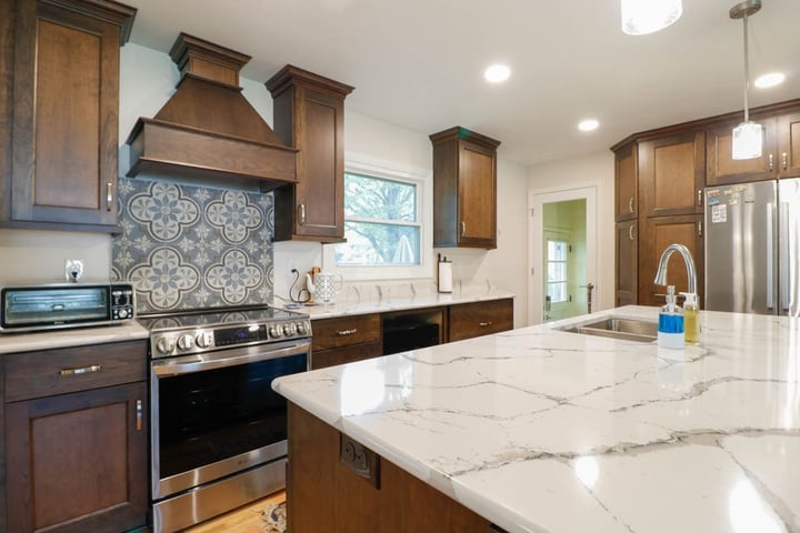 close up of custom home kitchen island by Odd Fellows Contracting in Cornell Okemos, MI with quartz countertop detail