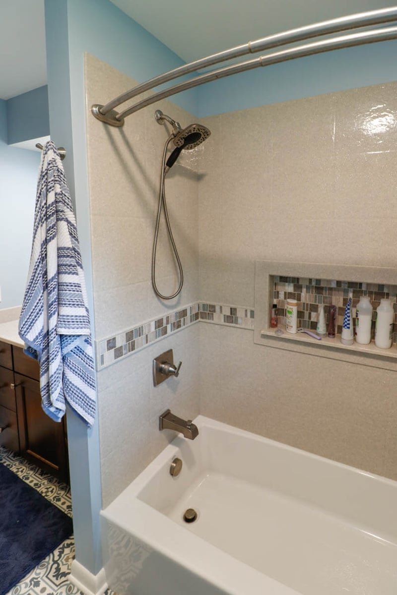 custom home bathroom by Odd Fellows Contracting in Cornell Okemos, MI with tiled shower and niche