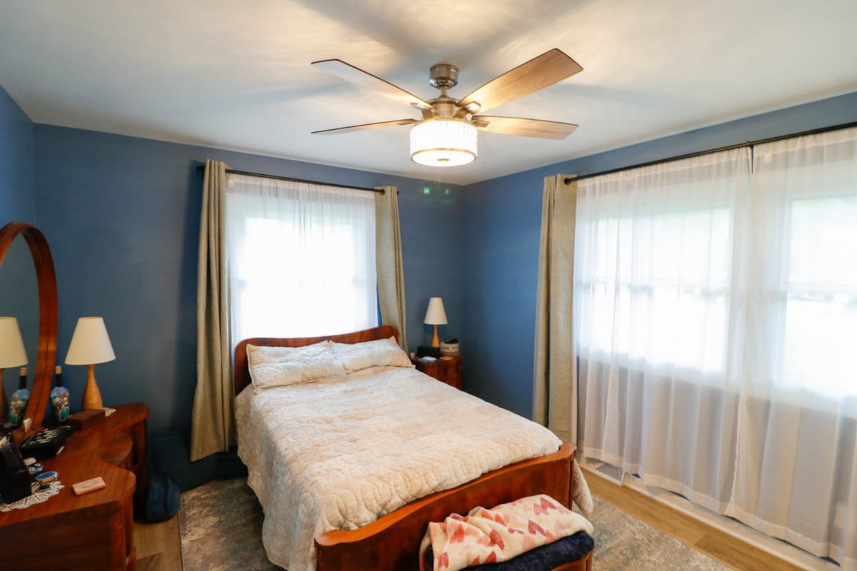 finished custom home bedroom in Cornell Okemos, MI by Odd Fellows Contracting with natural light