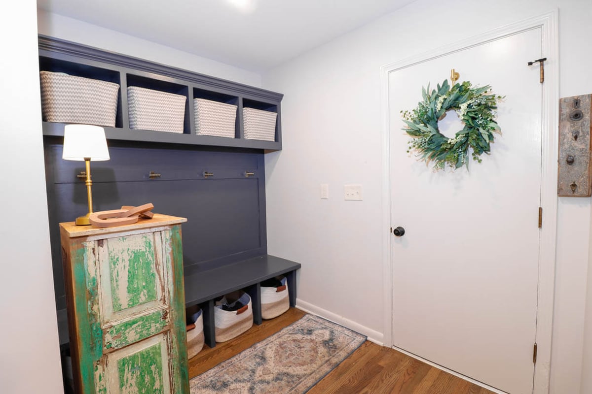 Mudroom remodel in a Tacoma Hills, MI custom home by Odd Fellows Contracting with built-in storage and bench seating.