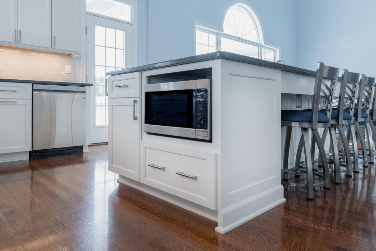 Kitchen island storage and microwave drawer in Williamston MI kitchen renovation by Odd Fellows Contracting