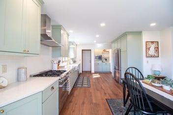 Wide angle view of remodeled kitchen by Odd Fellows Contracting in Holt Four Seasons, MI