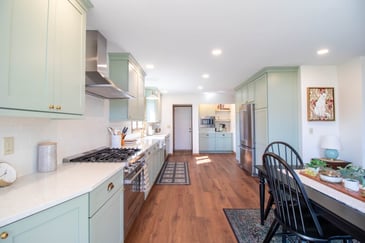 Wide angle view of remodeled kitchen by Odd Fellows Contracting in Holt Four Seasons, MI