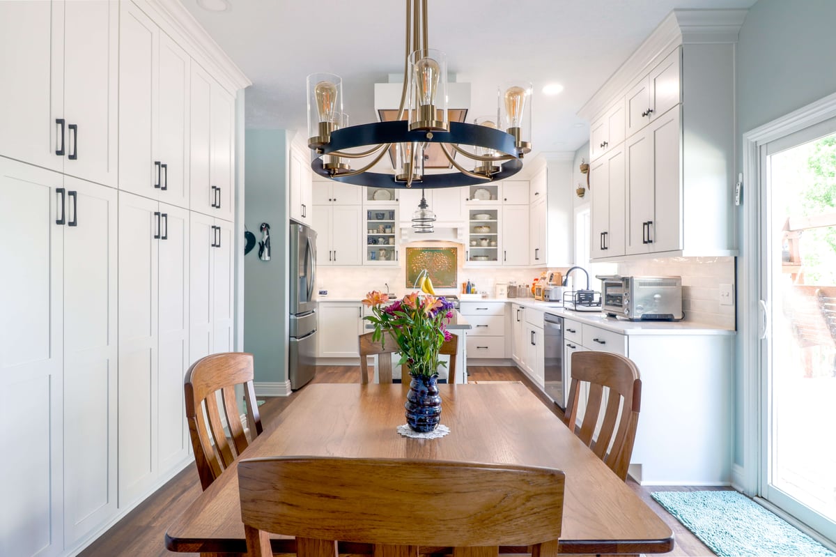 full kitchen remodel with white Pioneer cabinets and quartz countertop with tile backsplash