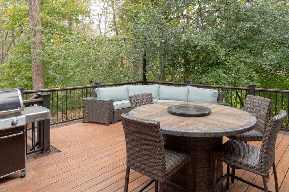 Backyard deck expansion with composite decking by Odd Fellows Contracting in Okemos MI