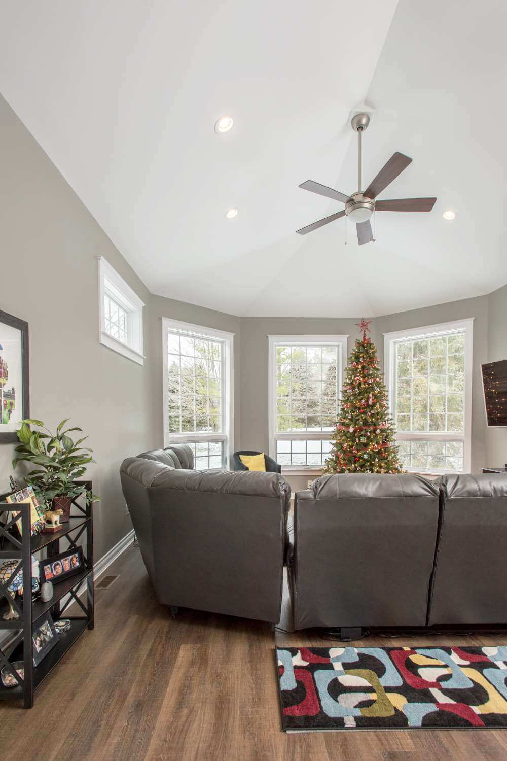 living room addition with vaulted ceiling and ceiling fan by Odd Fellows Contracting in Okemos, MI