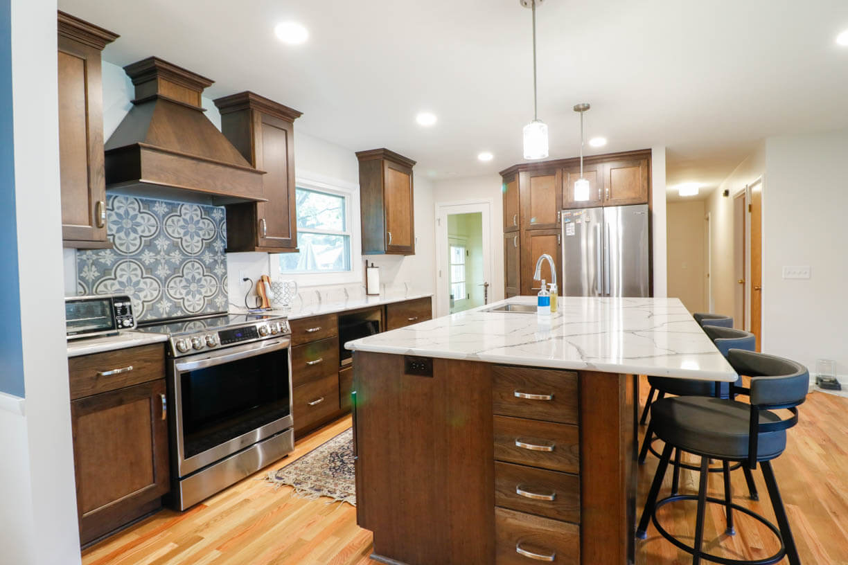 Cornell Okemos, MI custom home kitchen by Odd Fellows Contracting showcasing detailed cabinetry and island